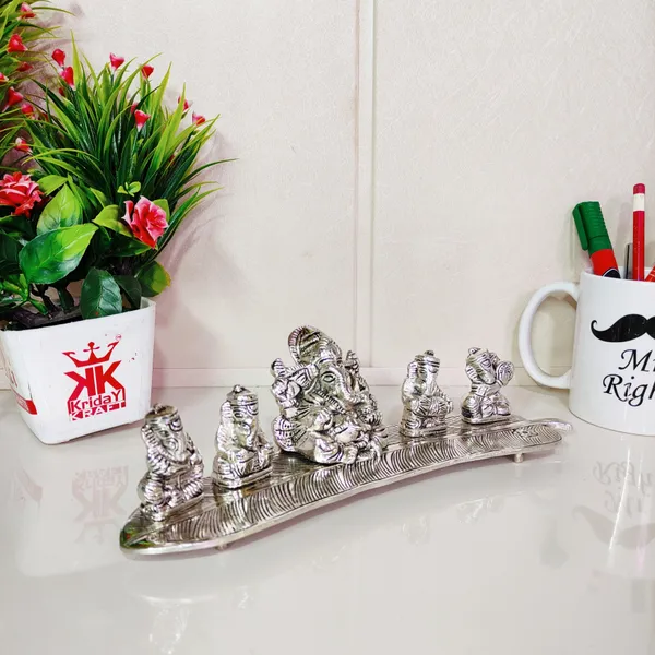 White_Metal_5_Ganesh_Silver_Plated_With_Musical_Instrument_On_Leaf_For_Home_DCor_Musical_Ganesha
